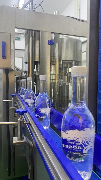 Bottles on the filling conveyor
